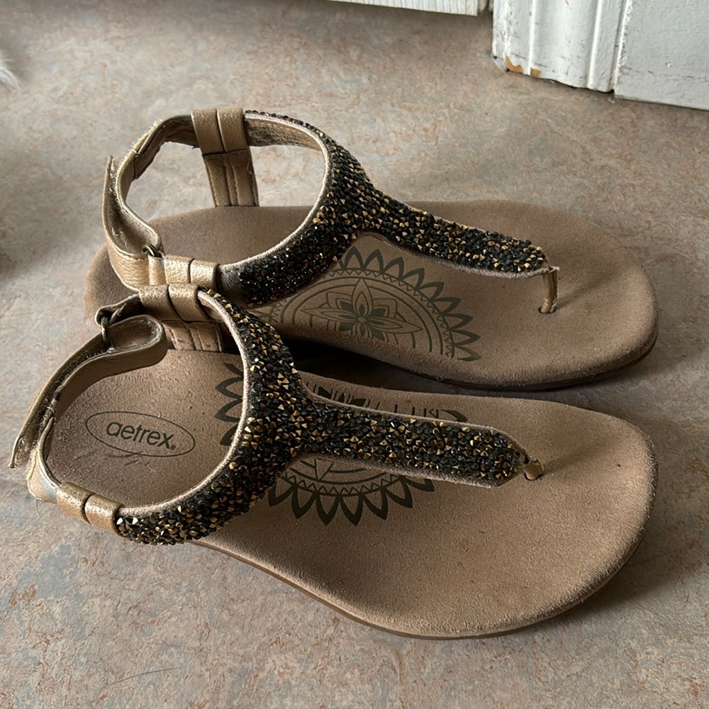 Gold t-strap Awtrex sandals